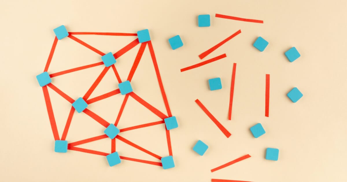 Abstract arrangement of blue blocks and red paper lines connecting it