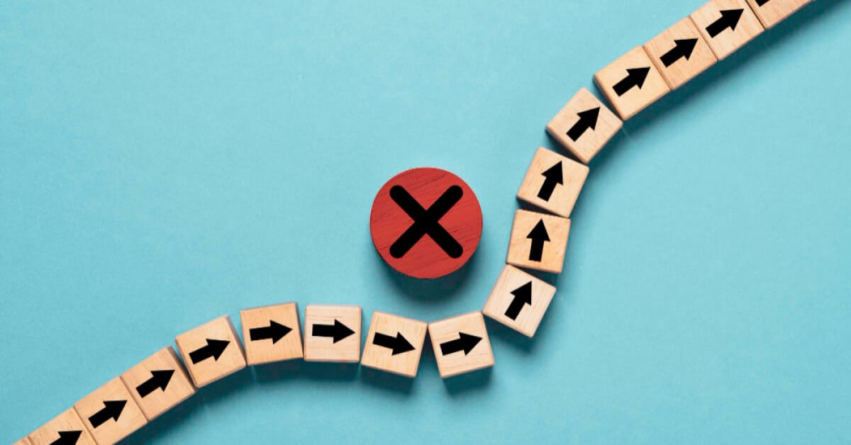 Red chip with cross mark, obstructing a series of chips with arrows