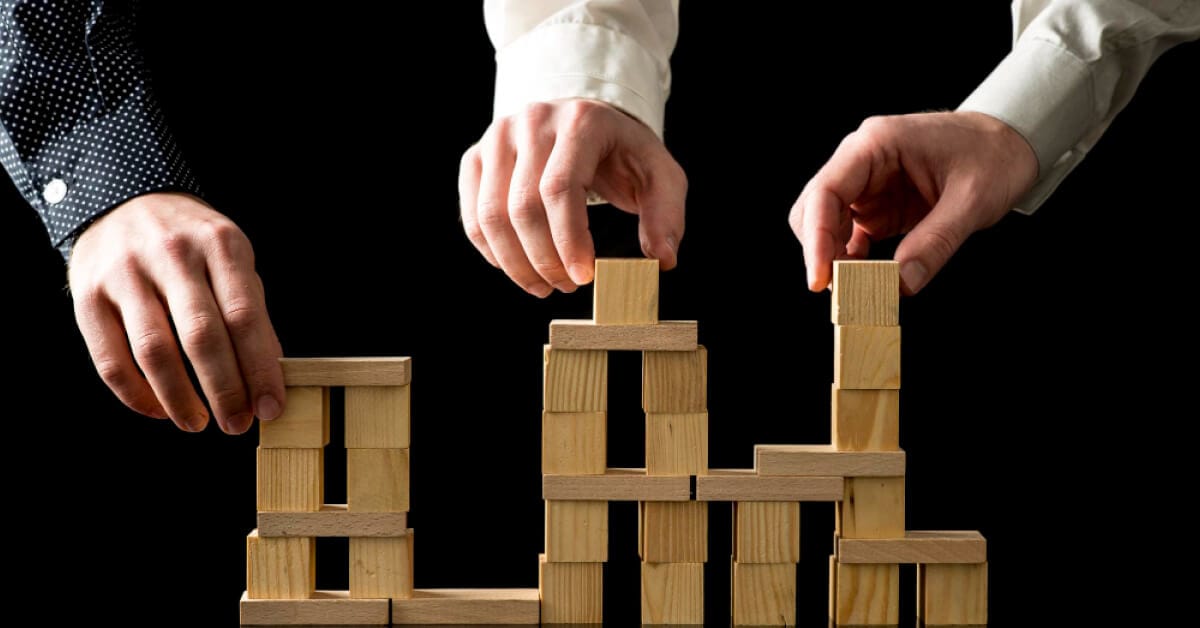 Team members collaborating to build