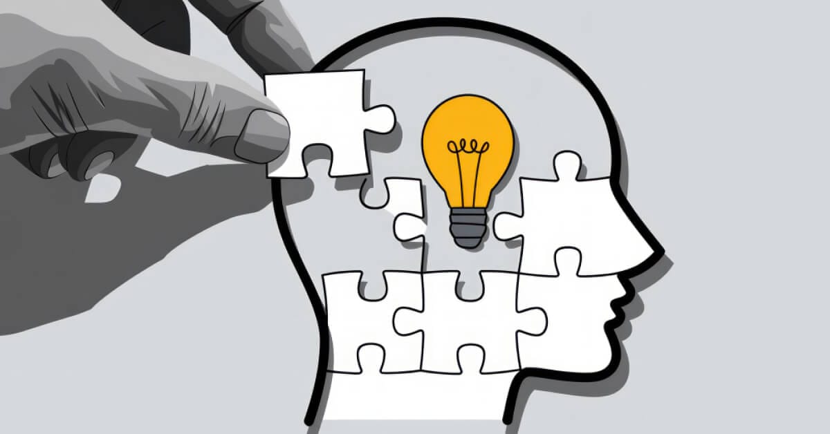 Person fixing a puzzle piece inside a head