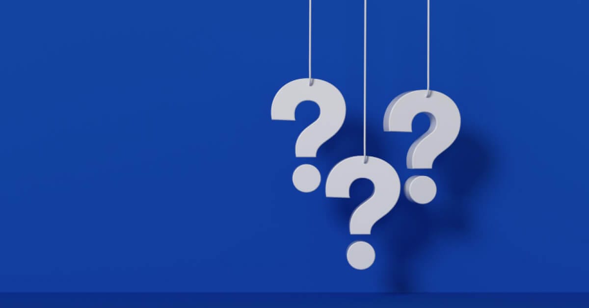 Question marks against a blue backdrop