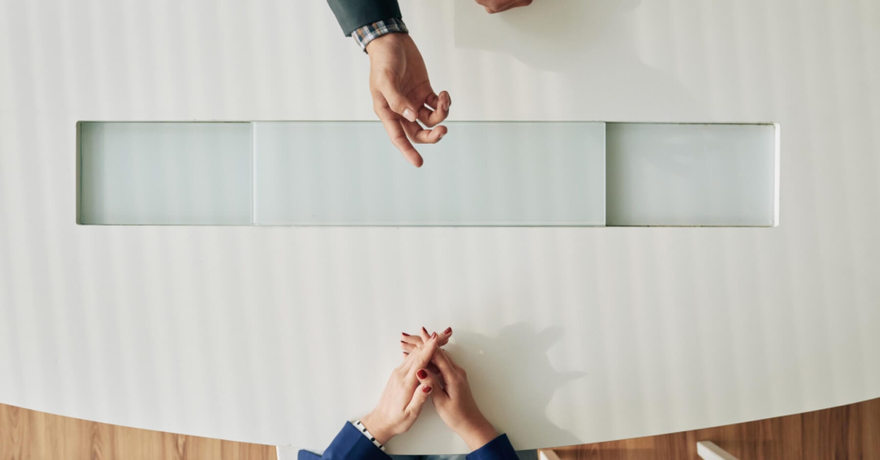 Hiring manager and candidate during a job interview for an interview report.