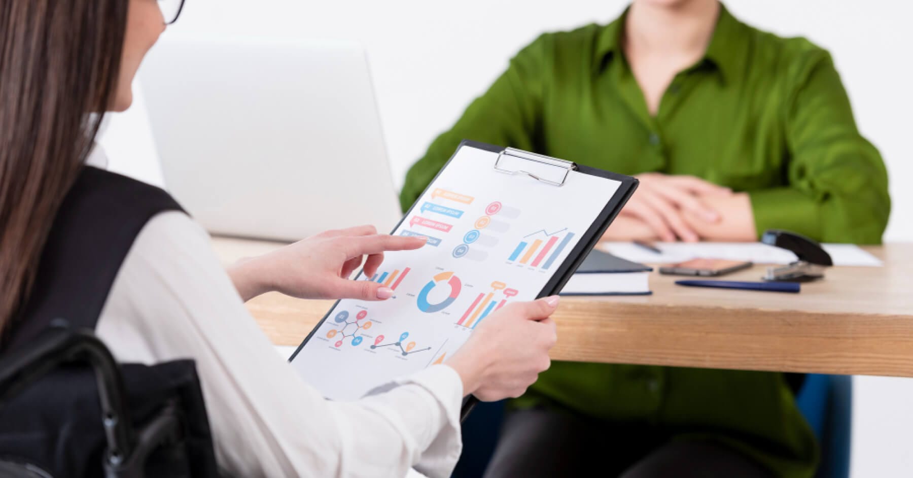 interviewer holding a analytic chart 