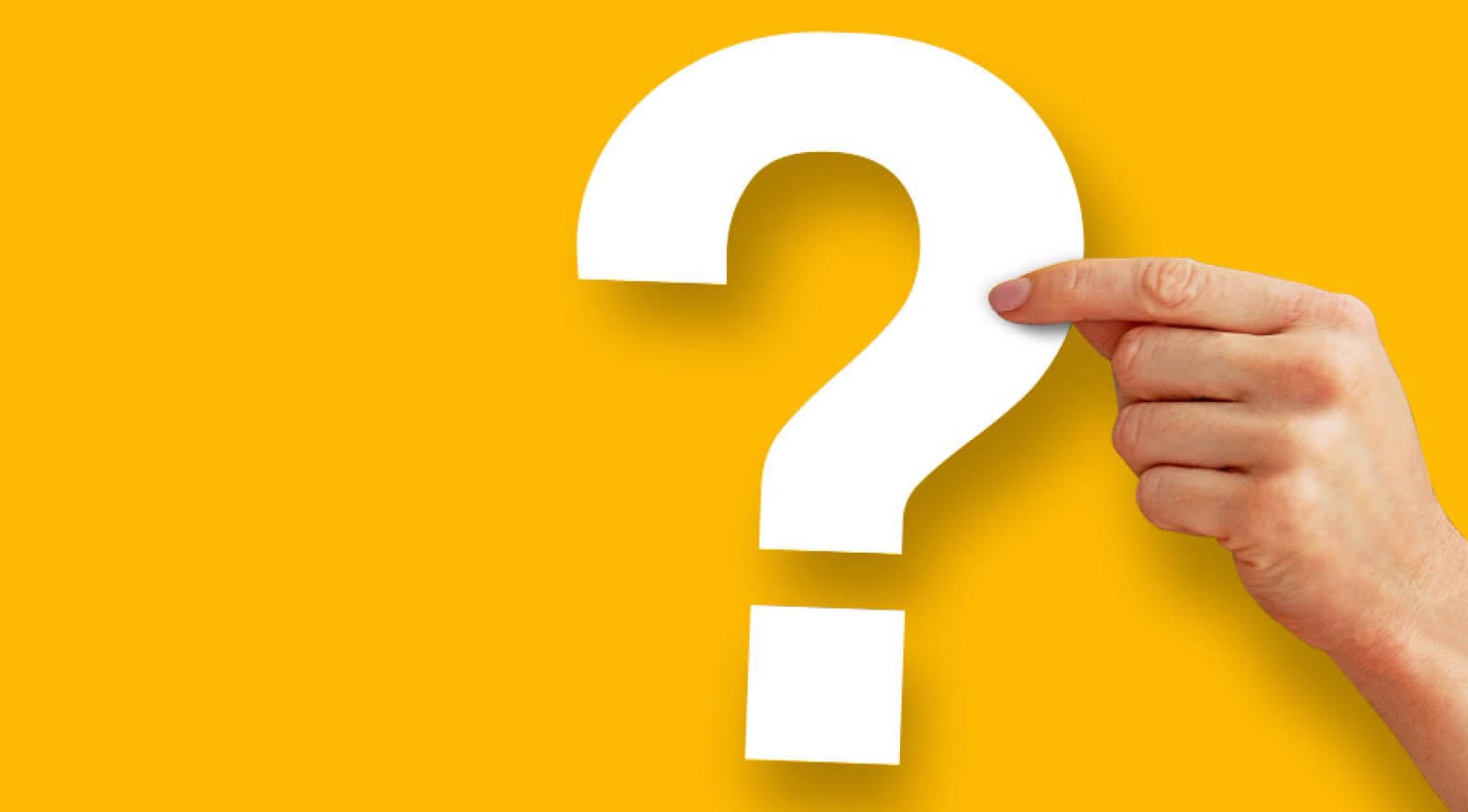 A hand holding a Question mark